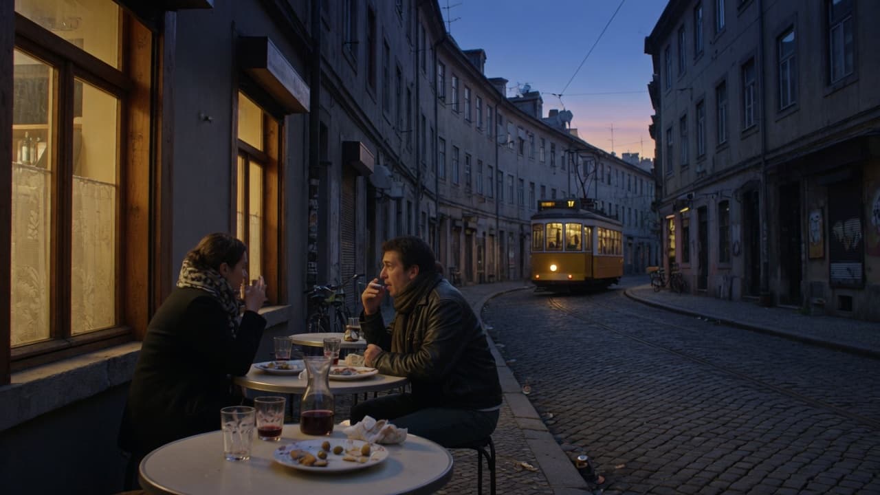 Evening cafe tables on a cobbled street at blue hour